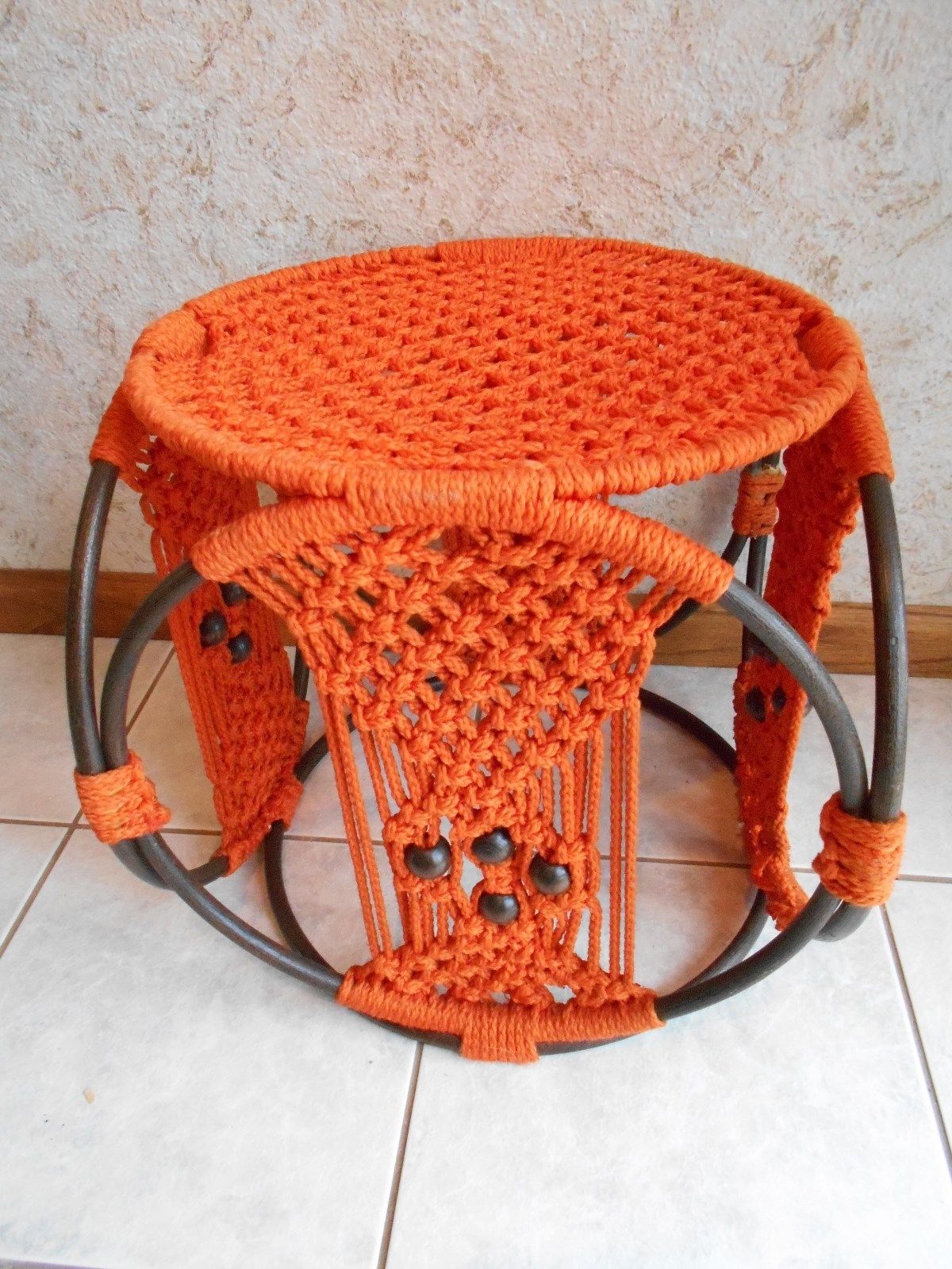 orange macrame footstool